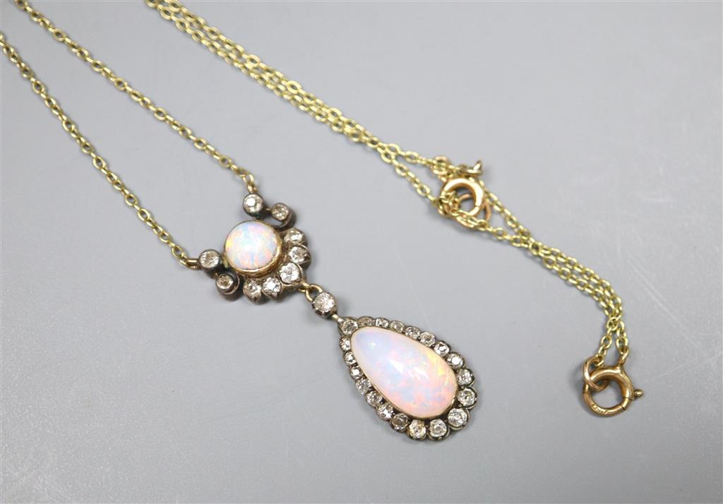 An Edwardian yellow and white metal, two stone white opal and diamond cluster set drop pendant necklace,